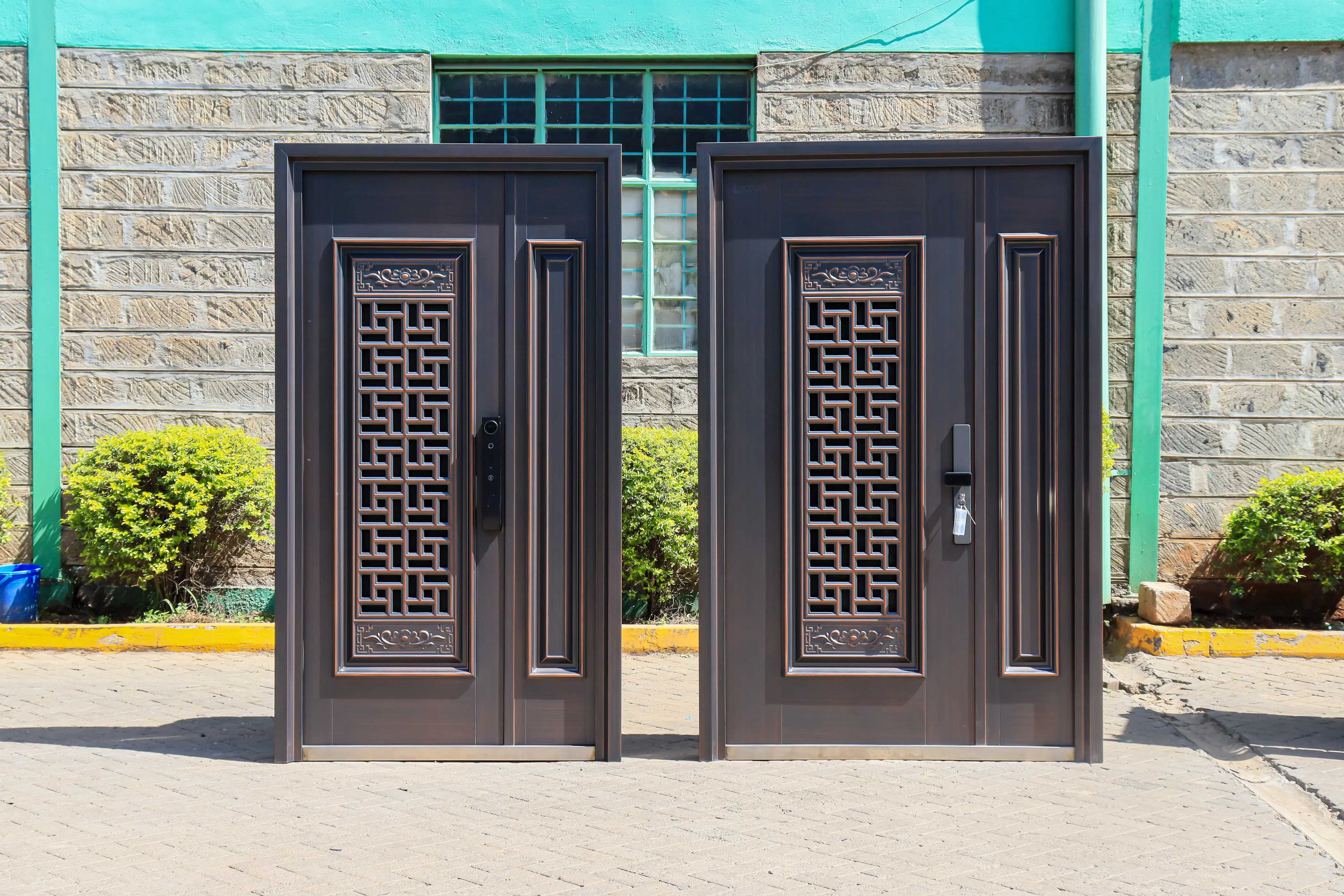 two copper brushed double steel doors side by side
