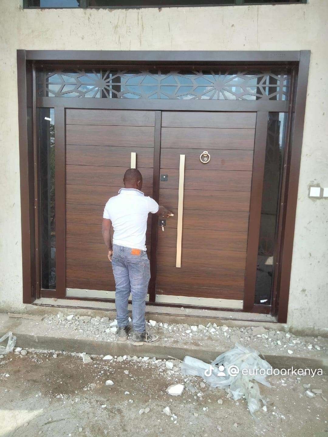 large oversized wood grain colored steel security door