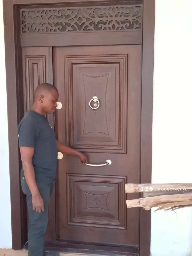 very wide 8 feet luxury double panel door  with glass on both sides and at the top installed in Runda estate in Kenya