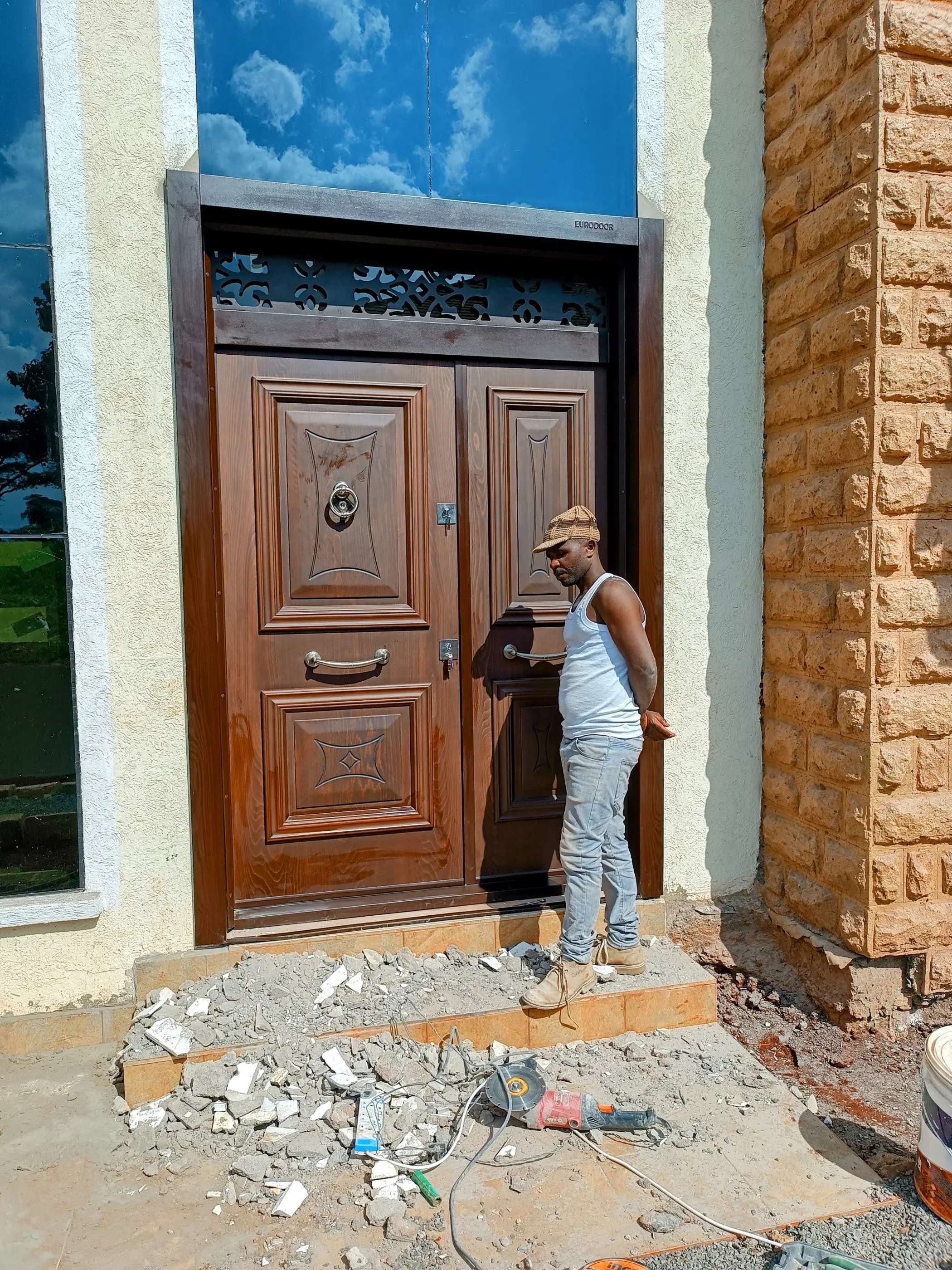 very wide 8 feet luxury double panel door  with glass on both sides and at the top installed in Runda estate in Kenya