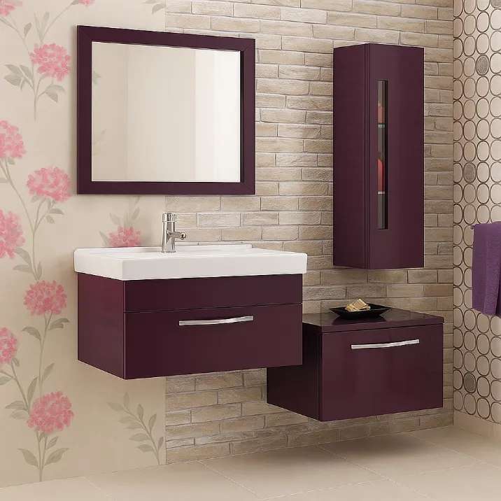 A modern wall-mounted vanity bathroom set featuring a glossy purple cabinet with built-in white sink and chrome tap, a matching framed mirror, a tall vertical storage unit, and a horizontal cabinet, set against a beige brick and floral wallpaper backdrop